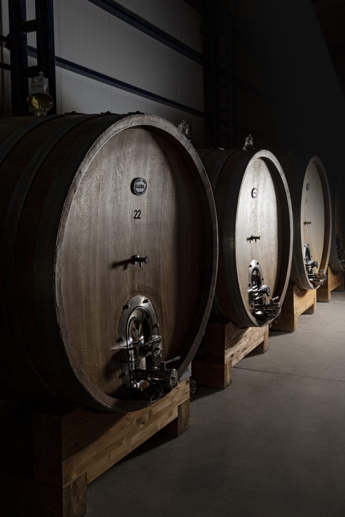 Ageing takes place in large oak vessels.