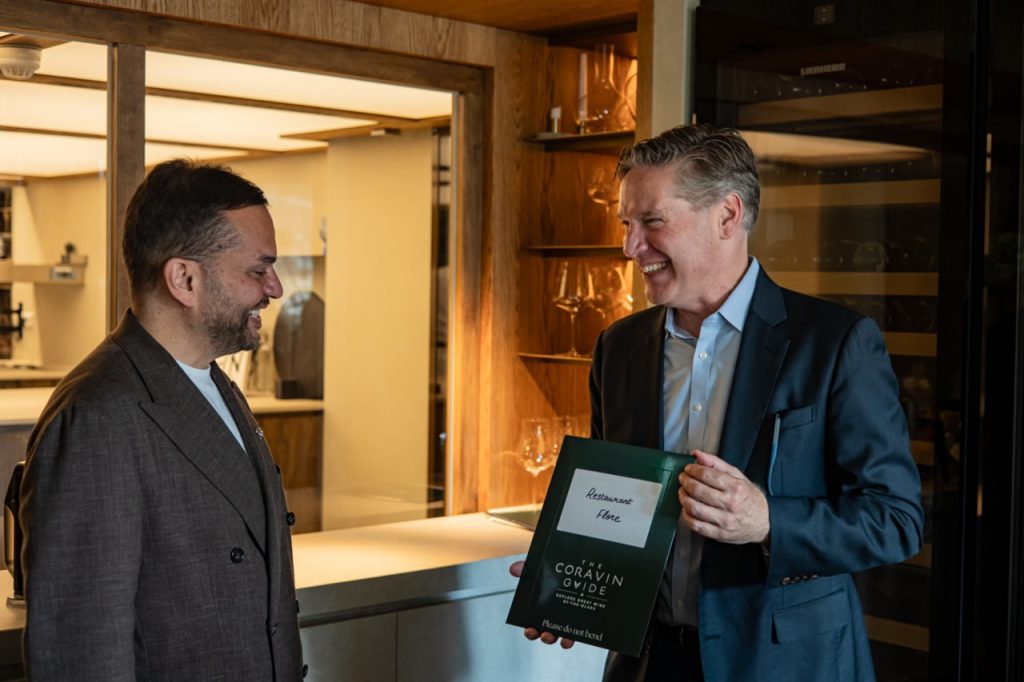 Antonello Nicastri receiving the distinction from Greg Lambrecht.